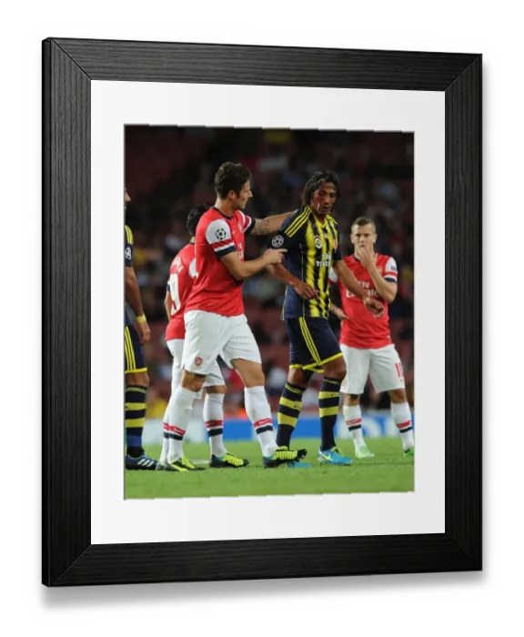 Framed Print : Arsenal's Olivier Giroud Clashes with Fenerbahce's Bruno Alves in UEFA Champions League Play-offs
