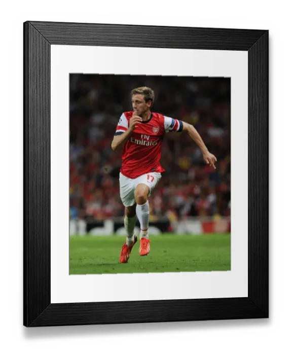 Framed Print : LONDON, ENGLAND - AUGUST 27: Nacho Monreal of Arsenal during the UEFA Champions League Play Off Second leg match