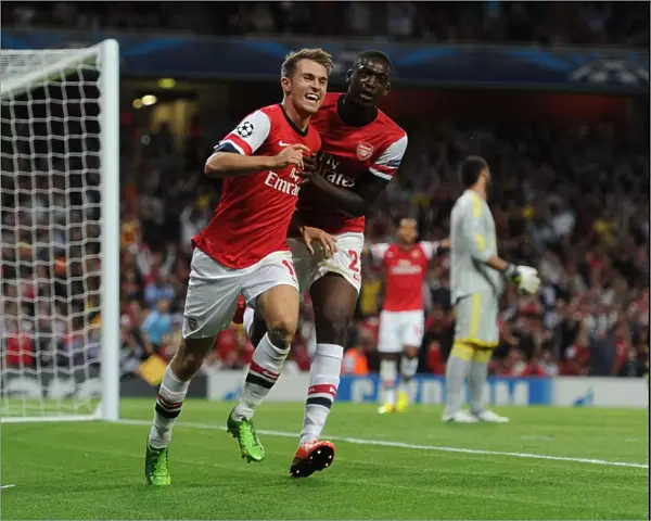 Arsenal Celebrate: Ramsey and Sanogo Score in Champions League Victory