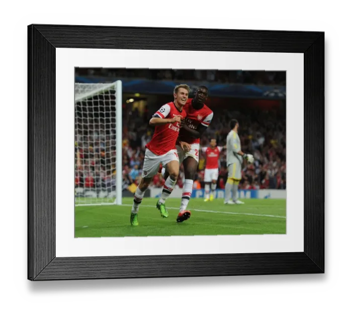 Framed Print : Arsenal Celebrate: Ramsey and Sanogo Score in Champions League Victory Framed Print : Arsenal Celebrate: Ramsey and Sanogo Score in Champions League Victory