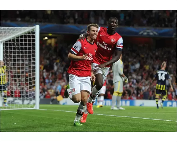 Arsenal's Aaron Ramsey and Yaya Sanogo Celebrate Goals in UEFA Champions League Play-offs Against Fenerbahce (2013)