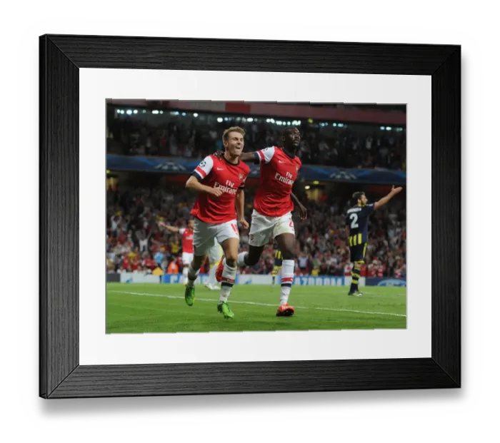 Framed Print : Arsenal's Ramsey and Sanogo: United in Victory - Celebrating Goals in the 2013-14 UEFA Champions League Play-offs against Fenerbahce Framed Print : Arsenal's Ramsey and Sanogo: United in Victory - Celebrating Goals in the 2013-14 UEFA Champions League Play-offs against Fenerbahce