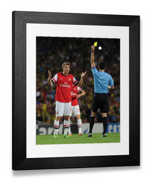 Framed Print : Arsenal's Aaron Ramsey Shown Yellow Card by Referee Carlos Velasco Carballo in Champions League Clash vs Fenerbahce (2013) Framed Print : Arsenal's Aaron Ramsey Shown Yellow Card by Referee Carlos Velasco Carballo in Champions League Clash vs Fenerbahce (2013)