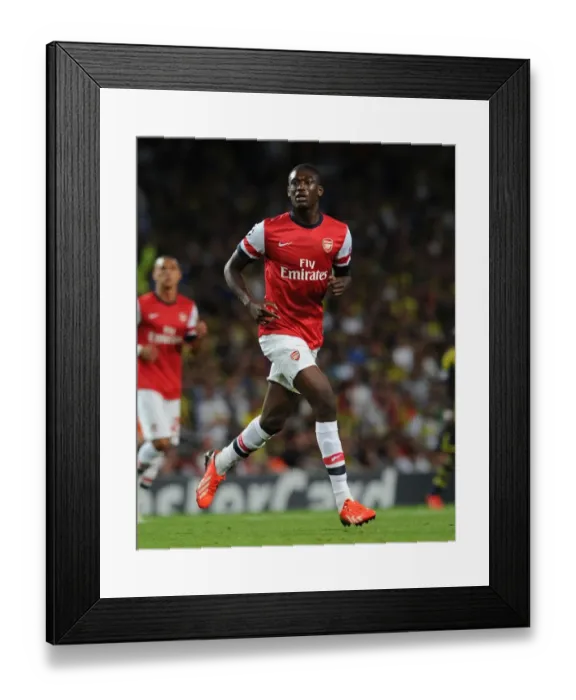 Framed Print : Yaya Sanogo in Action: Arsenal vs Fenerbahce UEFA Champions League Play-offs (2013)