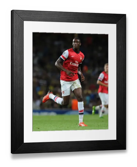 Framed Print : Yaya Sanogo in Action: Arsenal vs Fenerbahce, UEFA Champions League Play-offs (2013)