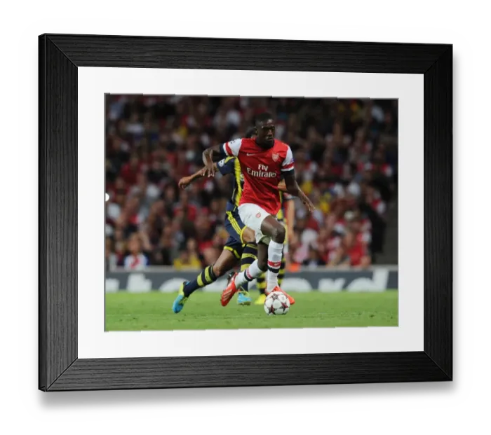Framed Print : Yaya Sanogo: Arsenal vs Fenerbahce, UEFA Champions League Play-offs (2013-14)