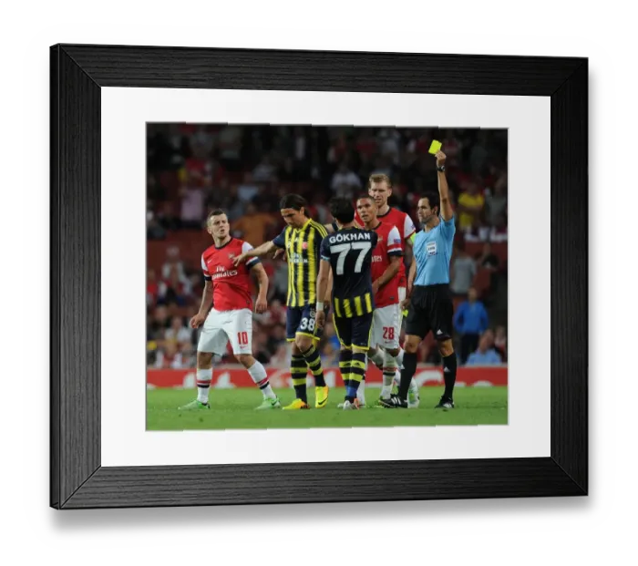 Framed Print : Arsenal v Fenerbahce: Wilshere Fouls Gonul - UEFA Champions League Play-offs Clash Framed Print : Arsenal v Fenerbahce: Wilshere Fouls Gonul - UEFA Champions League Play-offs Clash