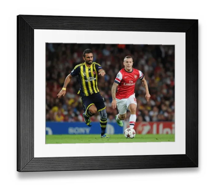 Framed Print : Jack Wilshere vs. Gokhan Gonul: Battle in the Arsenal v Fenerbahce UEFA Champions League Clash Framed Print : Jack Wilshere vs. Gokhan Gonul: Battle in the Arsenal v Fenerbahce UEFA Champions League Clash