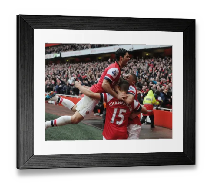 Framed Print : Arsenal's Triumph: Arteta, Oxlade-Chamberlain, and Gibbs Celebrate Second Goal vs Norwich City (2013)