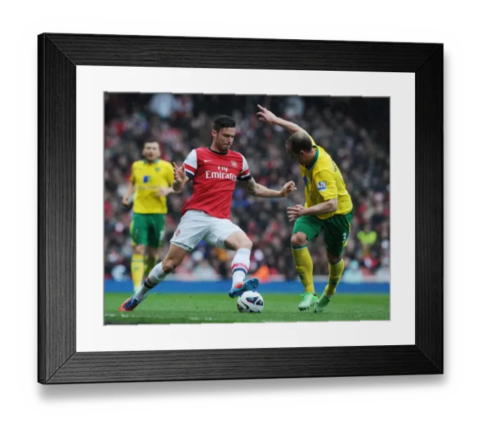 Framed Print : Arsenal's Olivier Giroud Outmaneuvers Norwich's Steven Whittaker during the 2012-13 Premier League Match