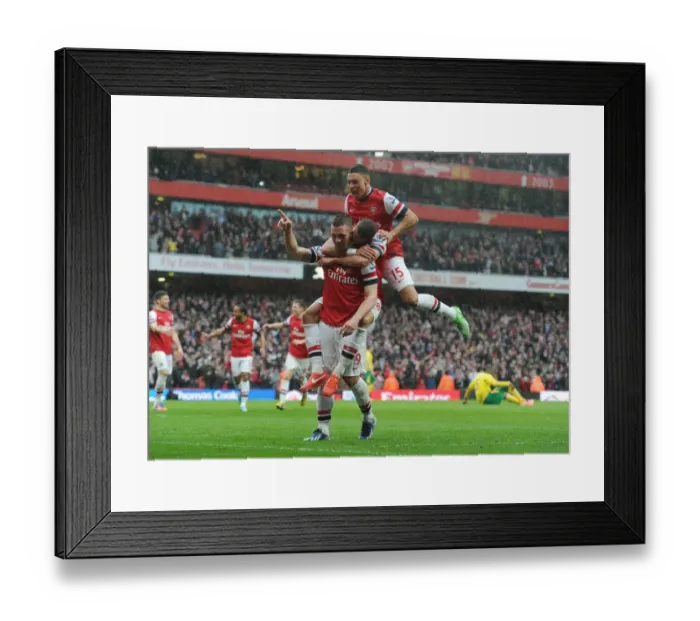 Framed Print : Arsenal's Podolski Scores Third Goal vs Norwich City (2012-13)