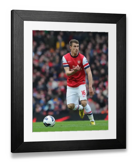 Framed Print : Arsenal's Aaron Ramsey in Action Against Norwich City (2012-13) Framed Print : Arsenal's Aaron Ramsey in Action Against Norwich City (2012-13)