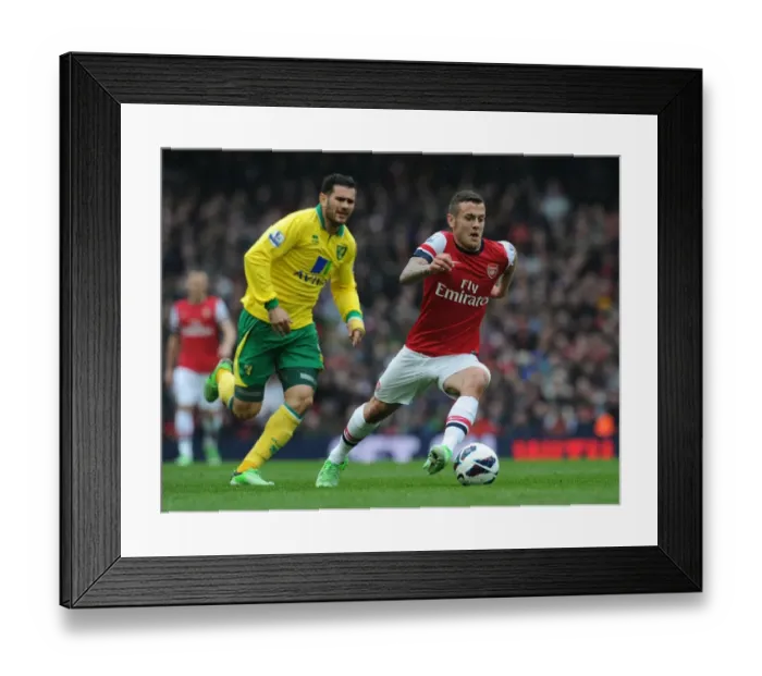 Framed Print : Arsenal's Jack Wilshere Surges Past Norwich's Bradley Johnson in 2012-13 Premier League Clash Framed Print : Arsenal's Jack Wilshere Surges Past Norwich's Bradley Johnson in 2012-13 Premier League Clash