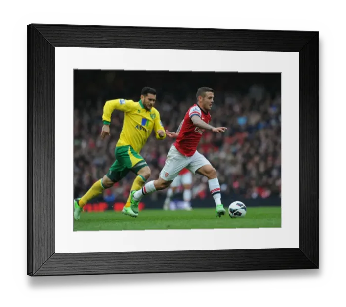 Framed Print : Jack Wilshere's Agile Moves: Outsmarting Norwich's Bradley Johnson in the 2012-13 Arsenal Showdown