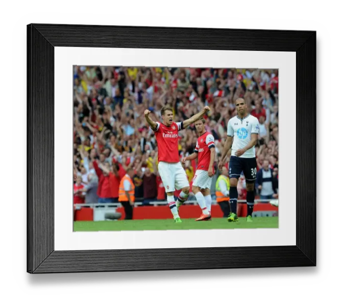 Framed Print : Aaron Ramsey's Euphoric Moment: Arsenal's Triumph Over Tottenham Hotspur (2013-14)