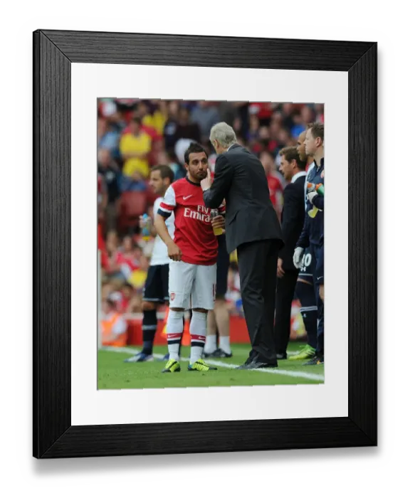Framed Print : Arsene Wenger Conferring with Santi Cazorla during Arsenal vs. Tottenham Rivalry (2013-14)