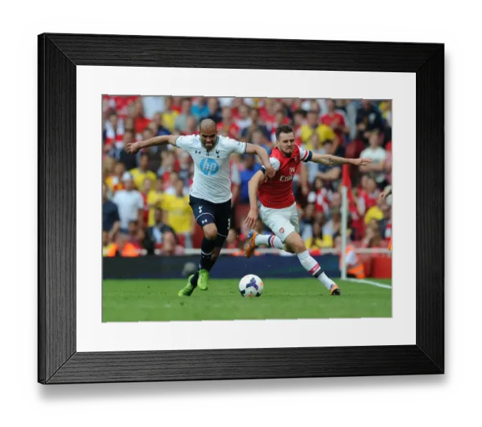 Framed Print : Arsenal's Carl Jenkinson Outmaneuvers Tottenham's Sandro in Premier League Clash