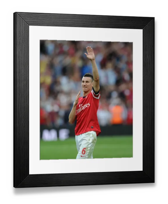 Framed Print : Laurent Koscielny's Emotional Victory Celebration: Arsenal's Triumph Over Tottenham Hotspur (2013-14)