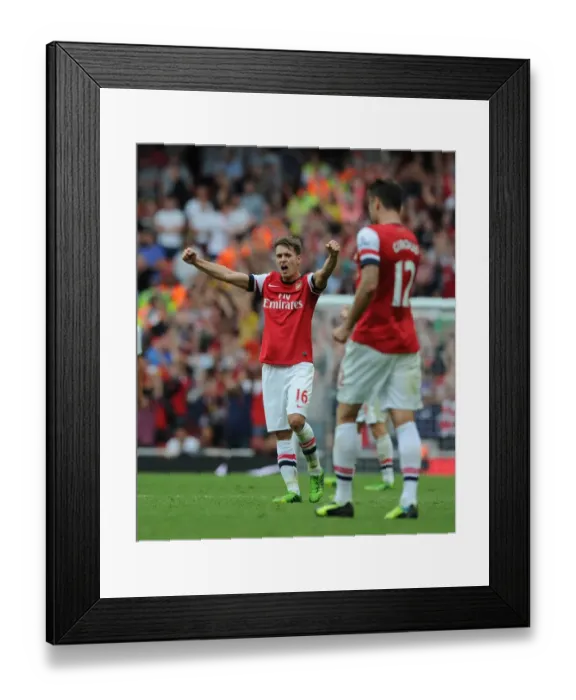Framed Print : Aaron Ramsey's Celebration: Arsenal's Victory over Tottenham Hotspur (2013-14)