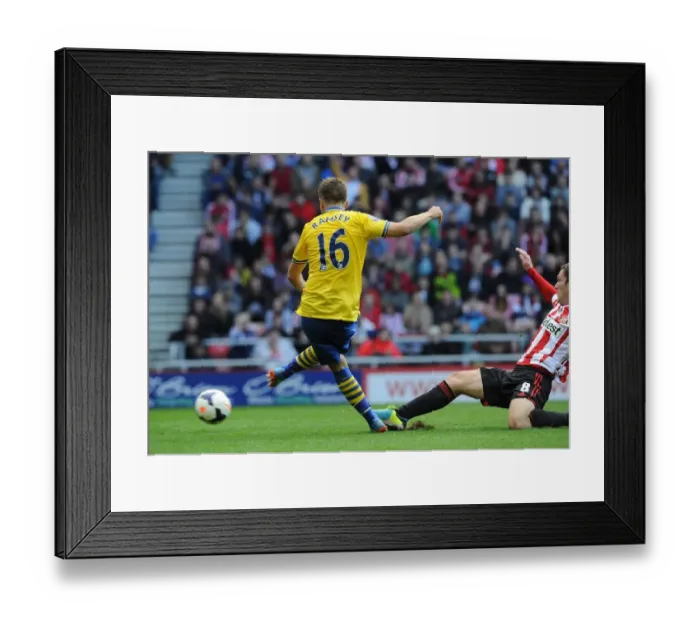 Framed Print : Aaron Ramsey Scores Against Craig Gardner: Sunderland vs. Arsenal, Premier League 2013-14
