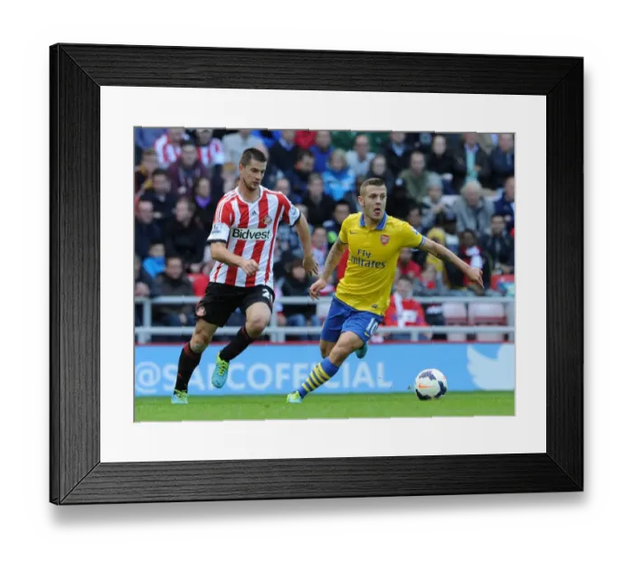 Framed Print : Jack Wilshere vs Valentin Roberge: Intense Clash in Sunderland v Arsenal (Premier League 2013-14)