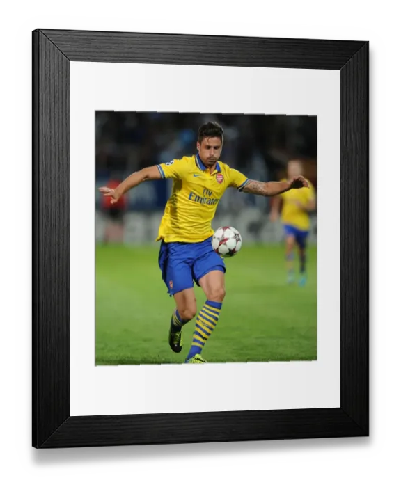Framed Print : Olivier Giroud: Arsenal's Star Striker in Action against Olympique Marseille (2013-14) Framed Print : Olivier Giroud: Arsenal's Star Striker in Action against Olympique Marseille (2013-14)