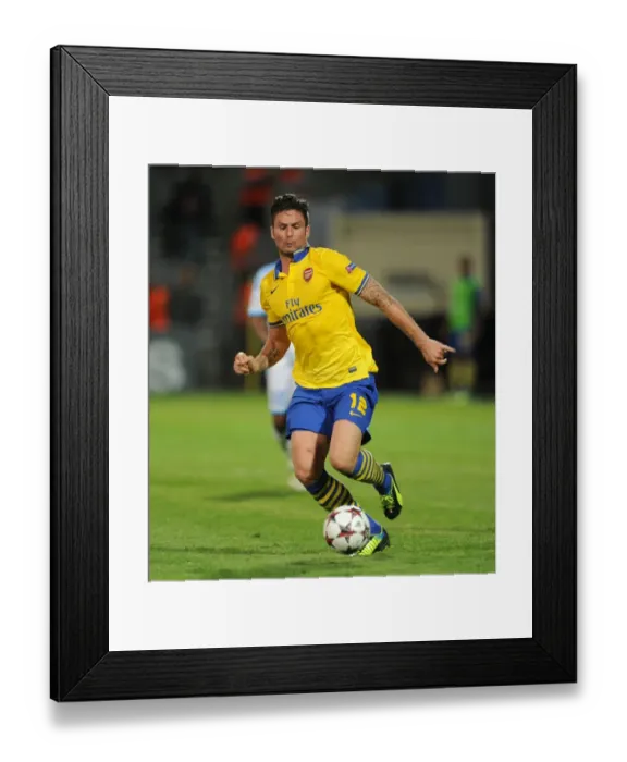 Framed Print : Olivier Giroud: Arsenal's Champion Striker Shines in UEFA Champions League Clash against Olympique Marseille (2013-14) Framed Print : Olivier Giroud: Arsenal's Champion Striker Shines in UEFA Champions League Clash against Olympique Marseille (2013-14)