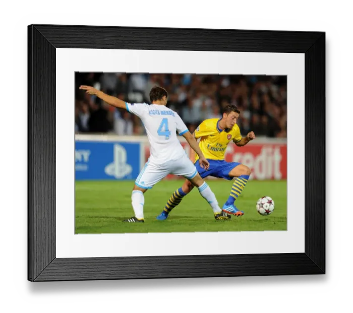 Framed Print : Mesut Ozil (Arsenal) Lucas Mendes (Marseille). Olympic Marseille 1: 2 Arsenal. UEFA Champions League