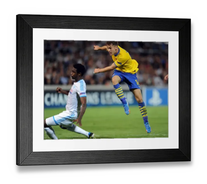 Framed Print : Aaron Ramsey Scores Arsenal's Second Goal Against Olympique Marseille in the 2013-14 Champions League