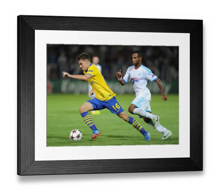 Framed Print : Clash of Midfielders: Ramsey vs. Imbula - Marseille vs. Arsenal, UEFA Champions League, 2013
