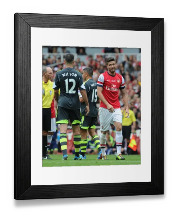 Framed Print : Arsenal's Olivier Giroud Engages in a Chat with Stoke City's Marc Wilson During the 2013-14 Premier League Match