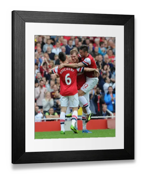 Framed Print : Arsenal's Per Mertesacker, Olivier Giroud, and Laurent Koscielny Celebrate Goals Against Stoke City (2013-14)