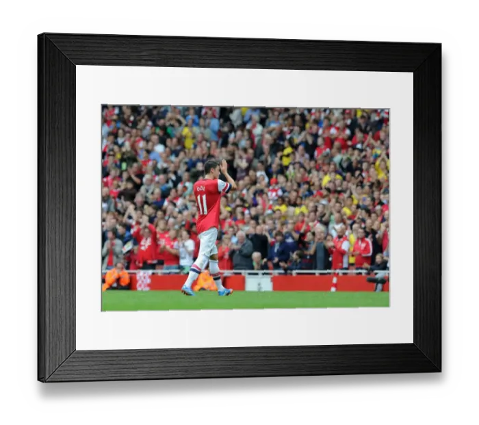 Framed Print : Mesut Ozil (Arsenal) claps the fans as he leaves the pitch. Arsenal 3: 1 Stoke City Framed Print : Mesut Ozil (Arsenal) claps the fans as he leaves the pitch. Arsenal 3: 1 Stoke City