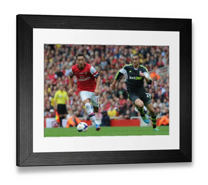 Framed Print : Mesut Ozil Outmaneuvers Geoff Cameron: Arsenal vs Stoke City, Premier League 2013-14 Framed Print : Mesut Ozil Outmaneuvers Geoff Cameron: Arsenal vs Stoke City, Premier League 2013-14