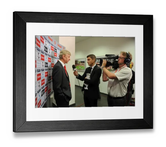 Framed Print : Arsene Wenger the Arsenal Manager talks to Sky before the match. Arsenal 3: 1 Stoke City