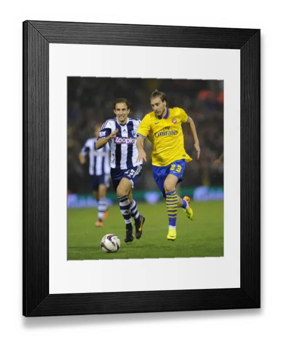 Framed Print : Nicklas Bendtner vs Craig Dawson: A Riveting Moment from Arsenal's Capital One Cup Clash with West Bromwich Albion (September 2013)