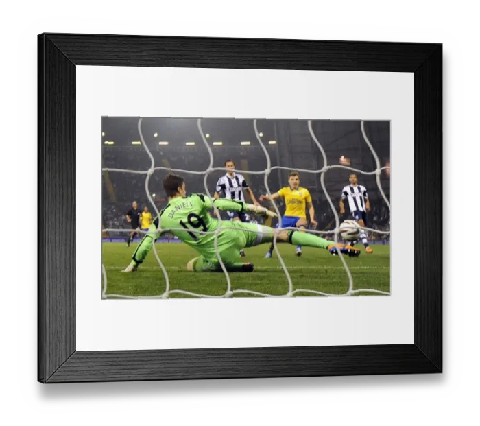 Framed Print : Thomas Eisfeld Scores the Winner: Arsenal Triumphs over West Bromwich Albion in Capital One Cup