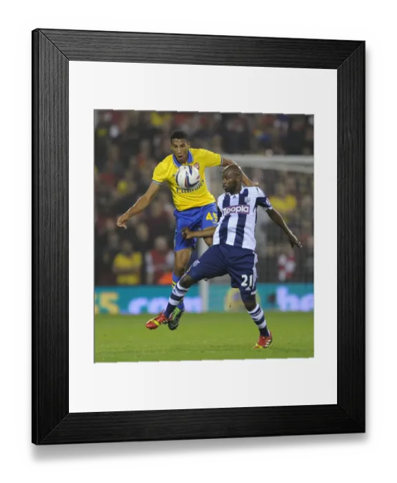 Framed Print : Arsenal and West Bromwich Albion Draw 1-1 in Capital One Cup: Isaac Hayden and Youssouf Mulumbu Battle it Out in Penalty Shootout Framed Print : Arsenal and West Bromwich Albion Draw 1-1 in Capital One Cup: Isaac Hayden and Youssouf Mulumbu Battle it Out in Penalty Shootout