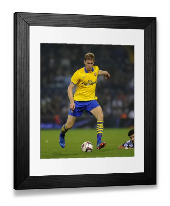 Framed Print : Per Mertesacker of Arsenal in Action against West Bromwich Albion - Capital One Cup, 2013