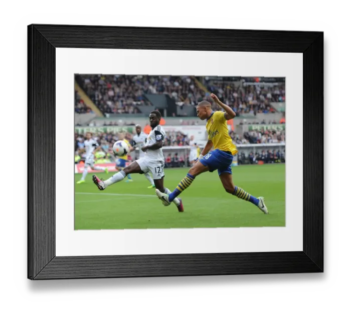 Framed Print : Clash at Liberty: Gibbs vs. Dyer in Swansea-Arsenal Premier League Showdown