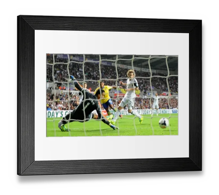 Framed Print : Serge Gnabry Scores First Arsenal Goal Against Swansea City: Strikes Past Michel Vorm, 2013-14 Framed Print : Serge Gnabry Scores First Arsenal Goal Against Swansea City: Strikes Past Michel Vorm, 2013-14