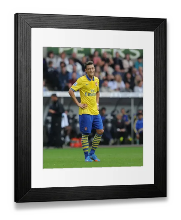 Framed Print : SWANSEA, WALES - SEPTEMBER 28: Mesut Ozil of Arsenal during the Swansea v Arsenal Premier Leageu match at Liberty Framed Print : SWANSEA, WALES - SEPTEMBER 28: Mesut Ozil of Arsenal during the Swansea v Arsenal Premier Leageu match at Liberty