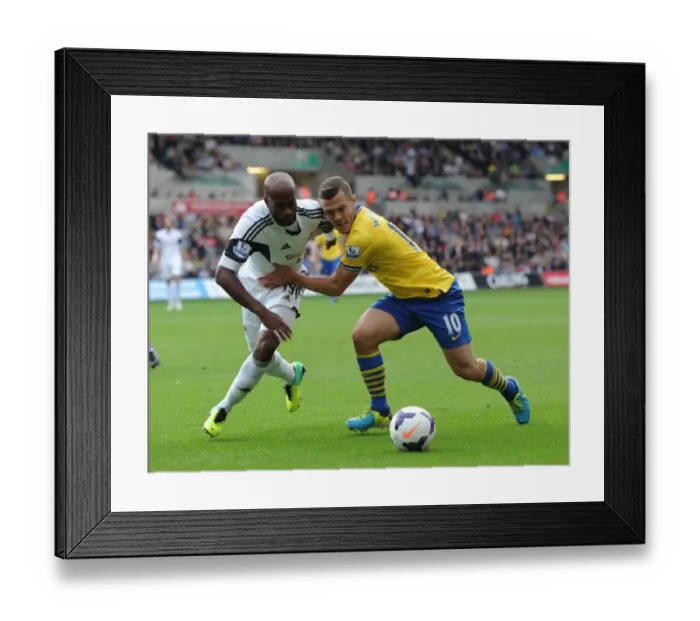 Framed Print : Jack Wilshere vs. Dwight Tiendalli: Intense Battle in Swansea City vs. Arsenal Premier League Clash Framed Print : Jack Wilshere vs. Dwight Tiendalli: Intense Battle in Swansea City vs. Arsenal Premier League Clash