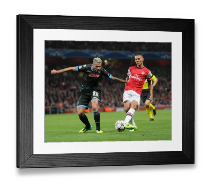 Framed Print : Kieran Gibbs (Arsenal) Valon Behrami (Napoli). Arsenal 2: 0 Napoli. UEFA Champions League Framed Print : Kieran Gibbs (Arsenal) Valon Behrami (Napoli). Arsenal 2: 0 Napoli. UEFA Champions League