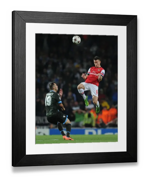 Framed Print : Arsenal vs. Napoli: Koscielny's Heading Battle in the 2013-14 Champions League Framed Print : Arsenal vs. Napoli: Koscielny's Heading Battle in the 2013-14 Champions League