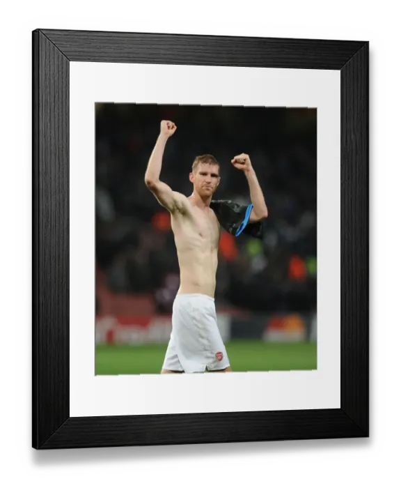 Framed Print : Per Mertesacker's Triumph: Arsenal's Champions League Victory Over Napoli (2013)