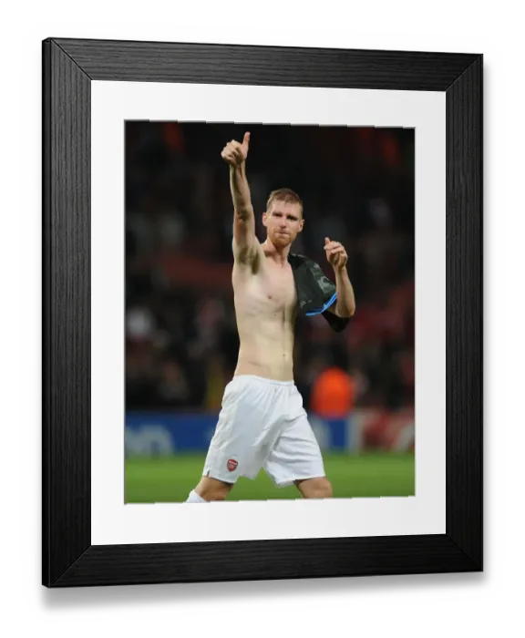Framed Print : Per Mertesacker's Triumph: Arsenal's Champions League Victory over Napoli (2013) Framed Print : Per Mertesacker's Triumph: Arsenal's Champions League Victory over Napoli (2013)
