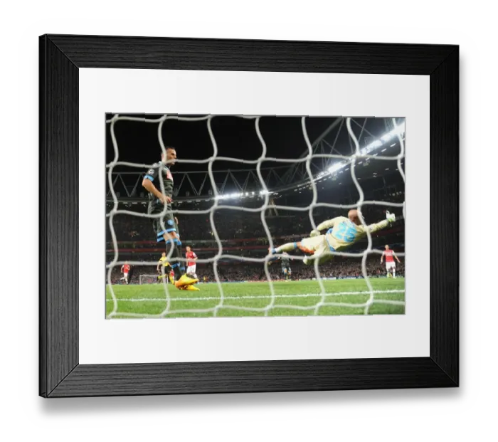 Framed Print : Mesut Ozil Scores Stunner Past Pepe Reina in Arsenal's UEFA Champions League Victory over Napoli (2013-14)