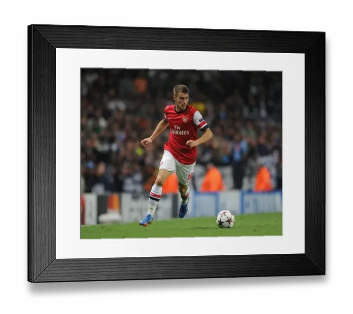 Framed Print : Arsenal's Aaron Ramsey in Action Against Napoli, UEFA Champions League 2013-14