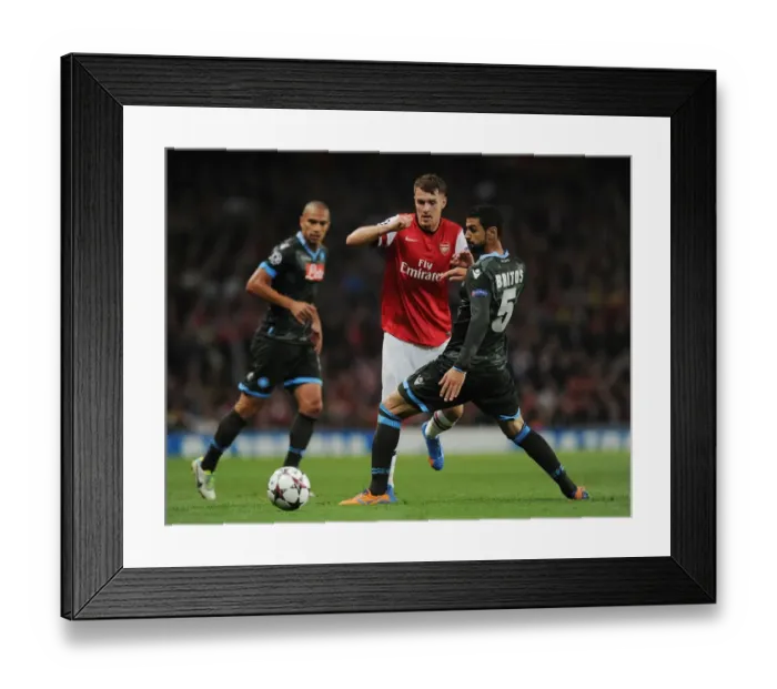 Framed Print : Clash of Forces: Ramsey vs. Britos in Arsenal vs. Napoli UEFA Champions League Showdown